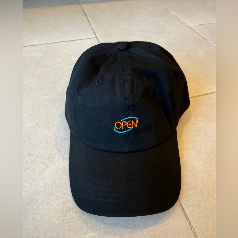 “Open” baseball cap